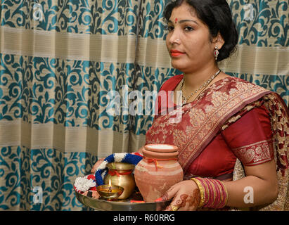 Indian woman doing Karwa Chauth Stock Photo