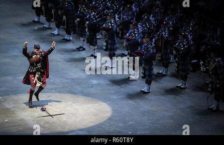A performer with Pipes and Drums, 1st Battalion Scots Guards, performs a traditional Scottish Highland Dance during the Virginia International Tattoo at the Scope Arena in Norfolk, Virginia, April 26, 2017. The Tattoo showcases over 1,000 performers from seven different nations, celebrating musical and military heritage from all over the world. Stock Photo