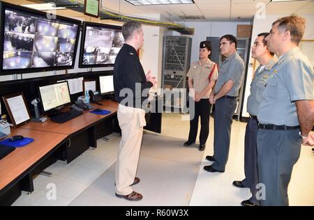 GREAT LAKES, Ill., (April 25, 2017) Capt. Michael S. Garrick, commanding officer at Recruit Training Command (RTC) explains the Master Control Room of the U. S. Navy’s largest simulator, USS Trayer (BST 21), to Vice Adm. Antonio Fernando Garcez Faria, Chief of Brazilian Navy Training, during a tour of Recruit Training Command (RTC) here, April 25. Trayer is a 210-foot-long Arleigh Burke-class destroyer replica where recruits go through Battle Stations, a grueling 12-hour culmination of basic training and the last evolution recruits accomplish before they graduate. Stock Photo