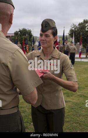 U.S. Marine Cpl. Nichole Fouse receives the Ammunition Technician of the Year Award at Marine Corps Base Camp Pendleton, Calif., April 28, 2017. The Marines and Sailors honored that day received awards based on performance, leadership, and unit safety contributions. Fouse is an ammunition technician with 1st Supply Battalion, Combat Logistics Regiment 15, 1st Marine Logistics Group. Stock Photo