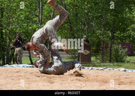 U.S. Army Rangers display their combative capabilities at the 5th Ranger Open House 2017 on Camp Merrill Ga., April 22, 2017. The 5th Ranger Training Battalion Open House 2017, welcomes the community of Dahlonega Ga., to display the skills and technical abilities of the U.S. Army Ranger. Stock Photo