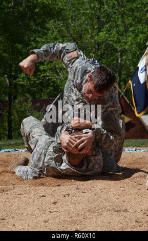 U.S. Army Rangers display their combative capabilities at the 5th Ranger Open House 2017 on Camp Merrill Ga., April 22, 2017. The 5th Ranger Training Battalion Open House 2017, welcomes the community of Dahlonega Ga., to display the skills and technical abilities of the U.S. Army Ranger. Stock Photo