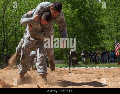 U.S. Army Rangers display their combative capabilities at the 5th Ranger Open House 2017 on Camp Merrill Ga., April 22, 2017. The 5th Ranger Training Battalion Open House 2017, welcomes the community of Dahlonega Ga., to display the skills and technical abilities of the U.S. Army Ranger. Stock Photo