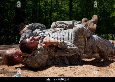 U.S. Army Rangers display their combative capabilities at the 5th Ranger Open House 2017 on Camp Merrill Ga., April 22, 2017. The 5th Ranger Training Battalion Open House 2017, welcomes the community of Dahlonega Ga., to display the skills and technical abilities of the U.S. Army Ranger. Stock Photo