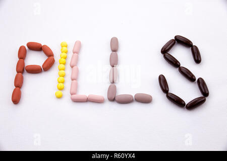 Conceptual Hand writing text caption inspiration Medical care Health concept written with pills drugs capsule word PILLS season On white isolated background with copy space Stock Photo