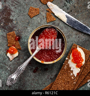 red caviar int tin with crispbreads and butter Stock Photo