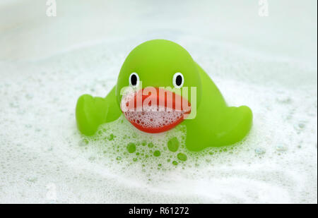 Green duck in a bathtub, surrounded by soap Stock Photo - Alamy