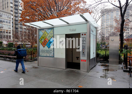 An automatic, self cleaning public pay toilet, public restroom--one of only five in New York City--in Madison Square Park. This one out of order. Stock Photo