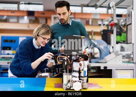 Young students of robotics working on project Stock Photo