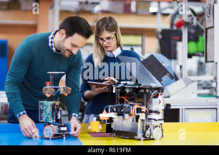 Young students of robotics working on project Stock Photo