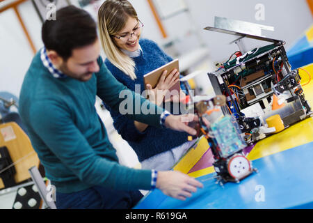Young students of robotics working on project Stock Photo