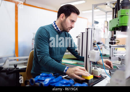 Young student of electronics working on project Stock Photo