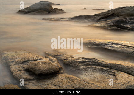 Beautiful sunrise in a bay with rocks in Costa Brava (Catalonia), Spain, long exposure Stock Photo