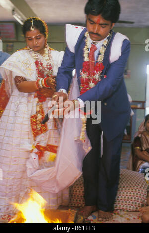 Indian wedding havan ceremony by Gujarati Brahmin couple, India MR#767 Stock Photo