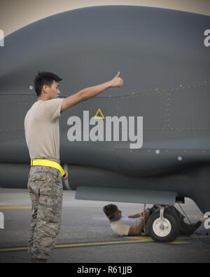 US Navy An Airman gives the thumbs up signal after a successful test of ...
