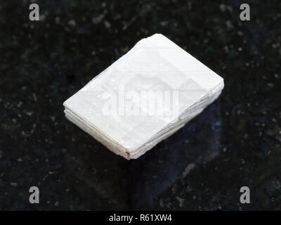 raw white calcite stone on dark background Stock Photo