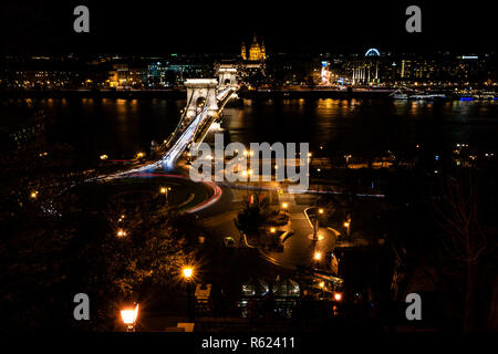 Budapest panorama at night with Chain Bridge over Danube and the St. Stephen Basilica's tower in the background Stock Photo
