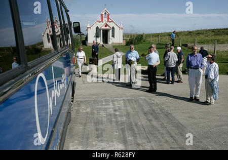 Tourists visit the Nissen hut Italian Chapel on the Orkney Isle of Lamb Holm built  during WW2 by Italian POW's Prisoners of War Stock Photo