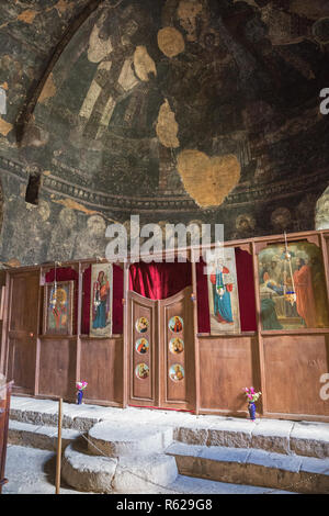 VARDZIA, GEORGIA - SEPTEMBER 25, 2018: Church of the Dormition, view to the apse and iconostasis decorated with icons Stock Photo