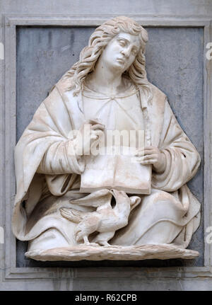 Saint John the Evangelist relief on the portal of the Cathedral of Saint Lawrence in Lugano, Switzerland Stock Photo