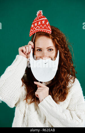 Portrait of playful girl celebrating Christmas Stock Photo