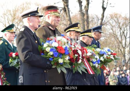 Members of the Michigan National Guard celebrated the 100th anniversary of Latvian independence with friends and colleagues in the National Armed Forces of Latvia, Riga, Latvia, Nov. 18, 2018. Michigan and Latvia have been aligned under the U.S. National Guard Bureau's State Partnership Program since 1993. The day included a ceremonial wreath laying at the foot of Riga's Freedom Monument, attended by dignitaries including (L-R) Admiral Haakon Bruun-Hanssen, chief of defense of Norway, Lt. Gen. Leonids Kalnins, chief of defense, National Armed Forces of Latvia, Lt. Gen. Stephen Twitty, deputy c Stock Photo