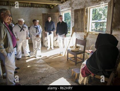 Sailors assigned to the Ohio-class cruise missile submarine USS Florida (SSGN 728) attend a tour of Mission San Luis during a namesake visit to the city of Tallahassee. Navy events such as the Florida namesake visit are interactive ways to share what the Navy does for our country with a number of different communities. Florida is one of four guided-missile submarines in the U.S Navy fleet and one of two SSGNs stationed at Naval Submarine Base Kings Bay, Georgia. Stock Photo