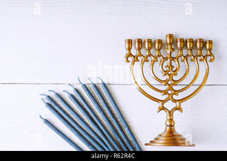 Traditional Hanukkah dishes on the white wooden table top view Stock Photo