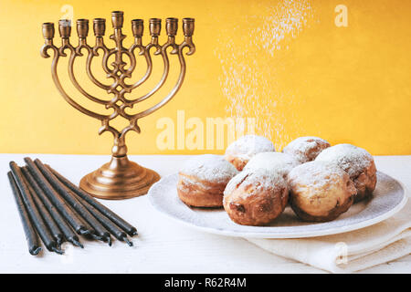 Traditional Hanukkah dishes on the white wooden table top view Stock Photo