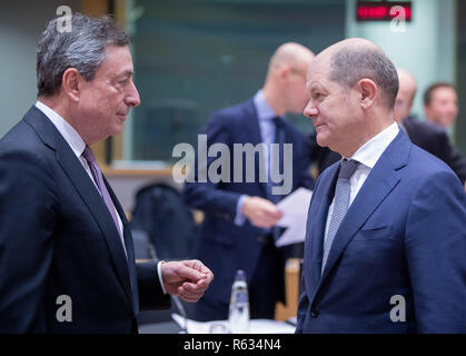 Brussels, Belgium. 3rd Dec, 2018. President of the European Central Bank Mario Draghi (L) talks with German Finance Minister Olaf Scholz during an Eurogroup Finance Ministers' meeting in Brussels, Belgium, Dec. 3, 2018. Credit: Thierry Monasse/Xinhua/Alamy Live News Stock Photo