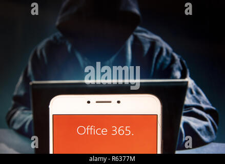 Hong Kong, China. 22nd Nov, 2018. Cloud-based software by Microsoft, Office 365, logo is seen on an Android mobile device with a figure of hacker in the background. Credit: Miguel Candela/SOPA Images/ZUMA Wire/17�Թ����� Live News Stock Photo