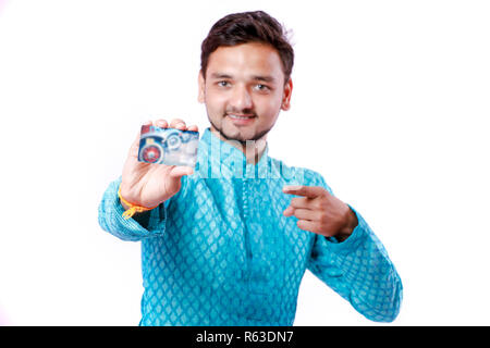 Indian man in ethnic wear and showing card Stock Photo