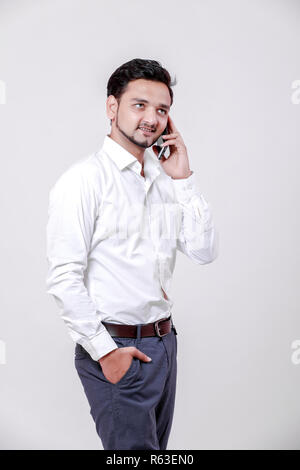 Young indian man using mobile Stock Photo