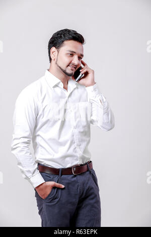Young indian man using mobile Stock Photo