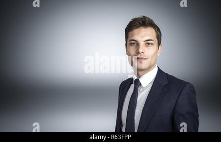 image of caucasian businessman studio shot on grey background Stock Photo
