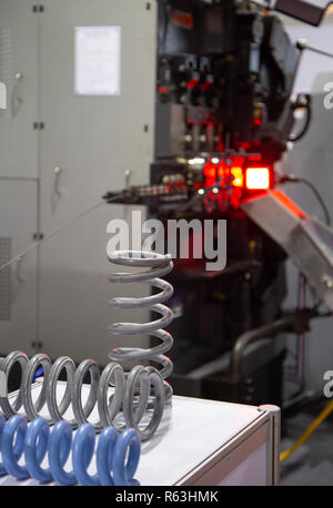 Automatic CNC spring coiling machine. Industrial machinery Stock Photo ...