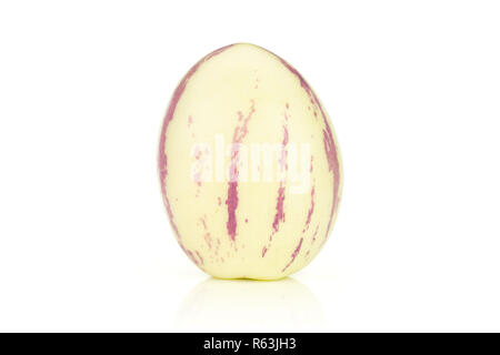 One whole fresh striped pepino melon egg shaped isolated on white background Stock Photo