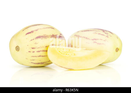 Group of two whole one slice of fresh striped pepino melon isolated on white background Stock Photo