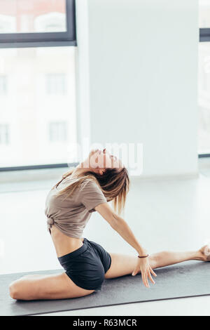 awesome ballet dancer during the workout. side view full length photo. Stock Photo