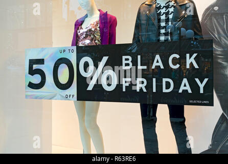 Close up of Black Friday sale sales discount sign signs on shop store window England UK United Kingdom GB Great Britain Stock Photo