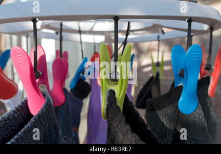 Close up of plastic peg pegs on laundry clothes dryer drying washing outside England UK United Kingdom GB Great Britain Stock Photo