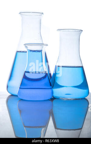 Glass flasks with blue fluid in used in chemistry experiments Stock Photo