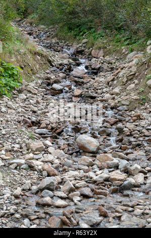 Bubbling Brook. close up of Water flowing in a small stream  Photographed in Stubaital, Tyrol, Austria Stock Photo