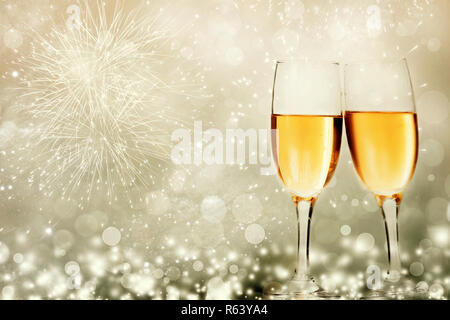 Glasses with champagne against fireworks Stock Photo