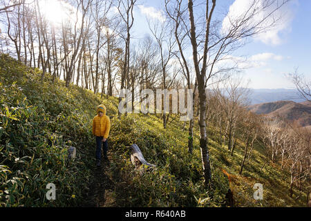 Young boy hiking on mt Hangetsu at Lake Chuzenji, Nikko, Japan Stock Photo