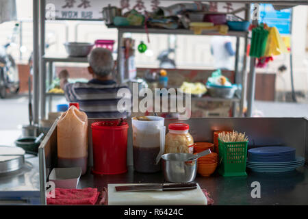 Penang, Malaysia - December 2016: Street food restaurant kitchen in Georgetown, Penang, Malaysia. Georgetown is famous for its street food culture. Stock Photo