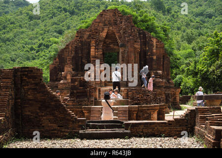My Son, Vietnam - Tourists walk among the ancient Hindu temple ruins of the Champa dynasty at My Son Vietnam in 2018 Stock Photo