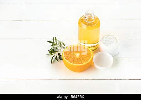 Spa concept with salt, mint, lotion, towel on white background Stock Photo