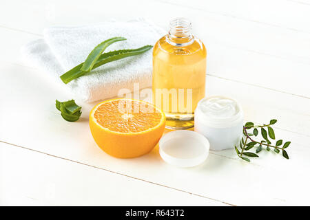 Spa concept with salt, mint, lotion, towel on white background Stock Photo