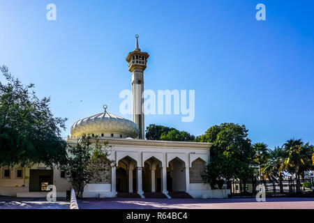 Dubai Al Farooq Mosque Frontal Entrance View with Minaret Trees and Picturesque Blue Sky Background Stock Photo